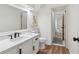 Bright bathroom with white cabinets, a modern sink, and a doorway leading to an adjacent room at 979 Bridgegate Ne Dr, Marietta, GA 30068