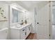 Stylish bathroom with a large mirror, double vanity, and a view into an adjacent room at 979 Bridgegate Ne Dr, Marietta, GA 30068