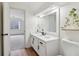 Bathroom featuring modern vanity, large mirror, and an open doorway to an adjacent bedroom at 979 Bridgegate Ne Dr, Marietta, GA 30068