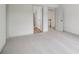 Bright bedroom featuring neutral carpeting, multiple doorways, and fresh paint throughout at 979 Bridgegate Ne Dr, Marietta, GA 30068