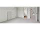 Spacious bedroom with neutral carpeting and access to a private bathroom and additional storage at 979 Bridgegate Ne Dr, Marietta, GA 30068