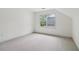 A bright bedroom with carpeting and a large window providing plenty of natural light at 979 Bridgegate Ne Dr, Marietta, GA 30068