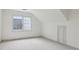 Bonus room with carpet, a window providing great natural light, and a door to storage at 979 Bridgegate Ne Dr, Marietta, GA 30068