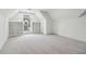 Bonus room with white carpet and bright window seat with flanking shelves at 979 Bridgegate Ne Dr, Marietta, GA 30068