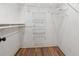 Walk-in closet with shelving for optimal organization and storage space at 979 Bridgegate Ne Dr, Marietta, GA 30068
