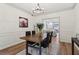 Dining room with decorative artwork and adjacent view into the living area at 979 Bridgegate Ne Dr, Marietta, GA 30068