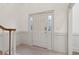Welcoming entryway with decorative wainscoting and stylish front door at 979 Bridgegate Ne Dr, Marietta, GA 30068