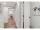 Hallway with wood floors leading to other rooms at 979 Bridgegate Ne Dr, Marietta, GA 30068