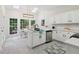 Open kitchen and dining area with white cabinetry, stainless appliances and natural light at 979 Bridgegate Ne Dr, Marietta, GA 30068