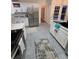 Bright kitchen with white cabinets, stainless steel appliances, and a subway tile backsplash at 979 Bridgegate Ne Dr, Marietta, GA 30068