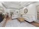 Bright living room featuring a stone fireplace, tray ceiling, and hardwood floors at 979 Bridgegate Ne Dr, Marietta, GA 30068