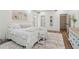 Bright main bedroom features neutral decor and a cozy faux fur rug at 979 Bridgegate Ne Dr, Marietta, GA 30068