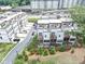An aerial view of modern townhomes featuring multiple floors and private outdoor spaces, surrounded by landscaped greenery at 2171 Burnside Dr Nw, Atlanta, GA 30318