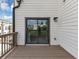 Balcony featuring a wooden deck, with a sliding glass door and outdoor lighting at 2171 Burnside Dr Nw, Atlanta, GA 30318