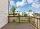 Balcony view overlooking a green space with contemporary buildings in the background at 2171 Burnside Dr Nw, Atlanta, GA 30318