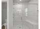 Modern bathroom featuring a glass shower, white subway tile, and a built-in bench at 2171 Burnside Dr Nw, Atlanta, GA 30318
