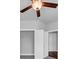 Bedroom with ceiling fan, closet, window and a glimpse of hardwood floors at 2171 Burnside Dr Nw, Atlanta, GA 30318