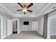 Large bedroom features a tray ceiling with fan, recessed lights, and balcony access at 2171 Burnside Dr Nw, Atlanta, GA 30318