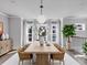 Dining room features a wooden table, seating for six, and natural light at 2171 Burnside Dr Nw, Atlanta, GA 30318
