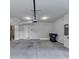 A spacious two car garage with bright lighting, with a concrete floor and modern door mechanism at 2171 Burnside Dr Nw, Atlanta, GA 30318