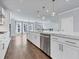 Modern kitchen featuring white cabinets, stainless steel appliances, and granite countertops at 2171 Burnside Dr Nw, Atlanta, GA 30318