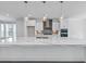 Kitchen showcasing a waterfall island, stainless appliances, and modern pendant lighting at 2171 Burnside Dr Nw, Atlanta, GA 30318