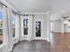 Bright living area featuring hardwood floors, neutral decor, and views to a porch at 2171 Burnside Dr Nw, Atlanta, GA 30318