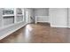 Bright living room with hardwood floors and natural light from multiple windows at 2171 Burnside Dr Nw, Atlanta, GA 30318