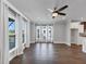 Spacious living room with hardwood floors, a ceiling fan, and multiple windows at 2171 Burnside Dr Nw, Atlanta, GA 30318