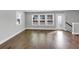 Open living room with hardwood floors and multiple windows offering natural light at 2171 Burnside Dr Nw, Atlanta, GA 30318