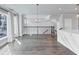 Open-concept living space with hardwood floors, natural lighting, and modern railing at 2171 Burnside Dr Nw, Atlanta, GA 30318