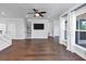 Open-concept living space with hardwood floors, modern fixtures, and an abundance of natural light at 2171 Burnside Dr Nw, Atlanta, GA 30318