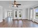 Bright living room with hardwood floors, a ceiling fan, and large windows at 2171 Burnside Dr Nw, Atlanta, GA 30318
