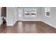 Bright living room with hardwood floors and natural light from multiple windows at 2171 Burnside Dr Nw, Atlanta, GA 30318