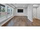 Bright living area with hardwood floors and large windows that offer plenty of natural light at 2171 Burnside Dr Nw, Atlanta, GA 30318