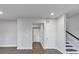Open floorplan features hardwood floors, neutral paint, stairs and white interior doors at 2171 Burnside Dr Nw, Atlanta, GA 30318