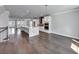Open layout of a kitchen & living area features modern finishes & hardwood flooring at 2171 Burnside Dr Nw, Atlanta, GA 30318