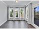 Bright and airy sunroom with hardwood floors, floor to ceiling windows, and natural light at 2171 Burnside Dr Nw, Atlanta, GA 30318