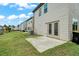 Backyard with a concrete patio and exterior view of the home at 2631 Lovejoy Crossing Dr, Hampton, GA 30228