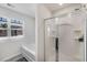 Bright bathroom featuring a bathtub, separate shower, and neutral decor at 2631 Lovejoy Crossing Dr, Hampton, GA 30228