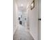 Upstairs hallway with neutral walls and carpet, connecting different areas of the home at 2631 Lovejoy Crossing Dr, Hampton, GA 30228