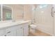 Well-lit bathroom with a shower-tub combo and vanity at 310 Autumn Glen Cir, Fayetteville, GA 30215