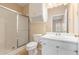 Bathroom features single sink vanity and shower with sliding doors at 310 Autumn Glen Cir, Fayetteville, GA 30215
