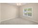 Neutral bedroom with carpeted floors, a ceiling fan and bright natural light at 310 Autumn Glen Cir, Fayetteville, GA 30215