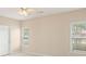Empty bedroom with carpeted floors, ceiling fan and two windows at 310 Autumn Glen Cir, Fayetteville, GA 30215