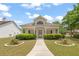 Charming single-story home featuring a covered front porch and manicured landscaping at 310 Autumn Glen Cir, Fayetteville, GA 30215