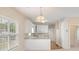 Eat-in kitchen with white cabinets, countertop and bright natural light at 310 Autumn Glen Cir, Fayetteville, GA 30215
