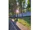 Well-maintained backyard featuring a grassy lawn and a retaining wall. Offers privacy at 3978 Devonshire Dr, Marietta, GA 30066
