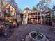 Expansive backyard with stone patio and lovely brick home featuring a gazebo-style screened-in porch at 3978 Devonshire Dr, Marietta, GA 30066