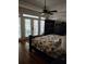 Spacious primary bedroom boasts hardwood floors, neutral decor, and modern ceiling fan at 3978 Devonshire Dr, Marietta, GA 30066